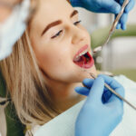 Beautiful girl sitting in the dentist’s office