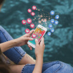 high-angle-woman-holding-smartphone