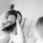 reflection-beautiful-woman-with-hand-hair