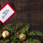 christmas-card-mock-up-with-ornaments-wooden-background