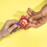 close-up-man-woman-holding-condom